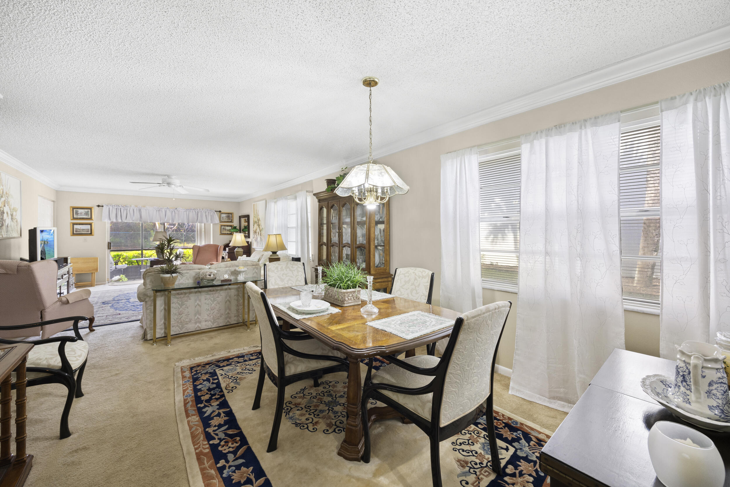 2975 Southwest 22nd Avenue, Unit 1080 Delray Beach, FL 33445 - Photo 8 of 67 a dining room with furniture window and outside view