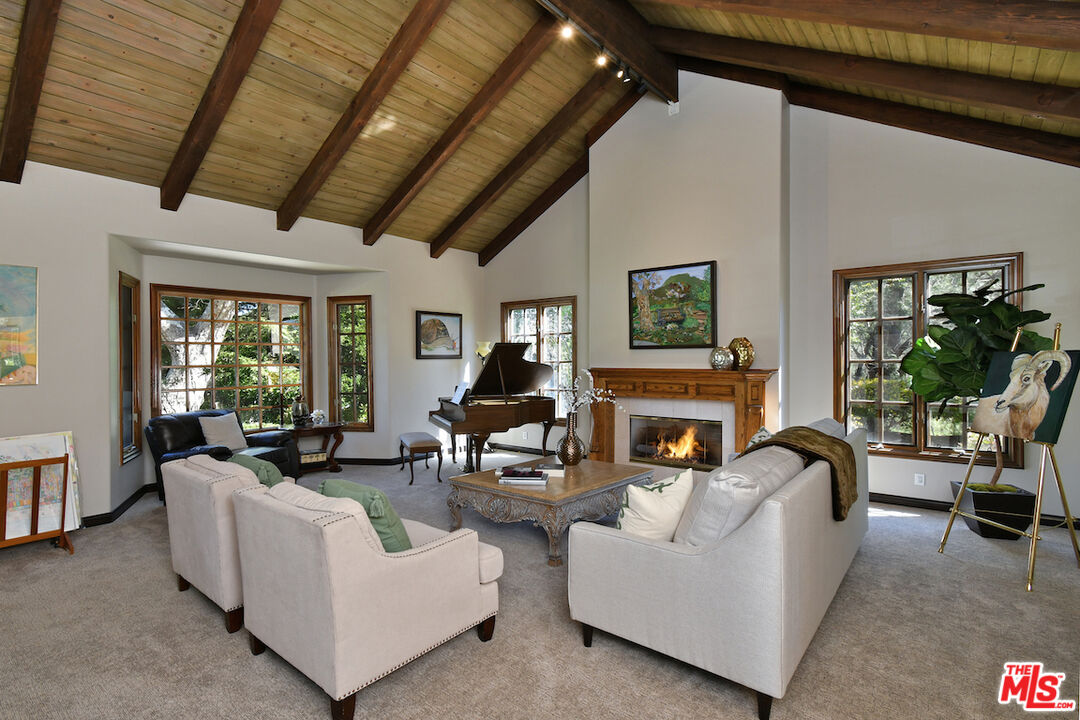 2317 Sierra Creek Road Agoura Hills, CA 91301 - Photo 12 of 73 a living room with furniture large window and flat screen tv