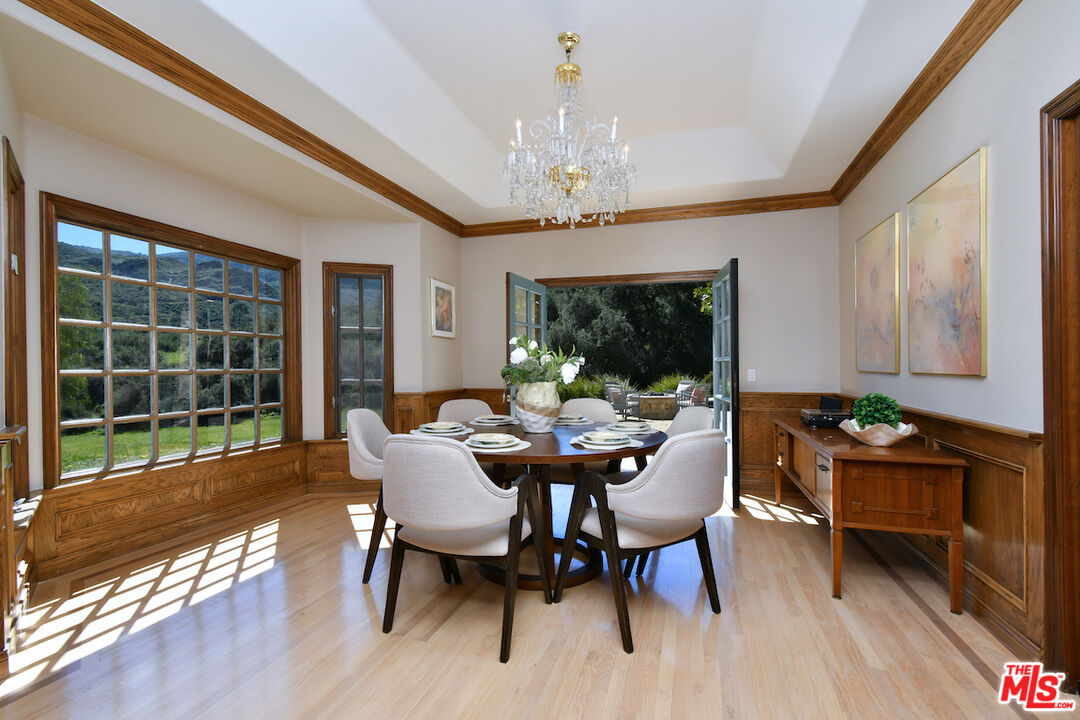 2317 Sierra Creek Road Agoura Hills, CA 91301 - Photo 16 of 73 a view of a dining room with furniture window and outside view