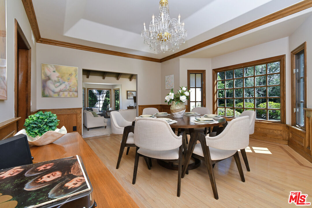 2317 Sierra Creek Road Agoura Hills, CA 91301 - Photo 17 of 73 a view of a dining room with furniture window and wooden floor