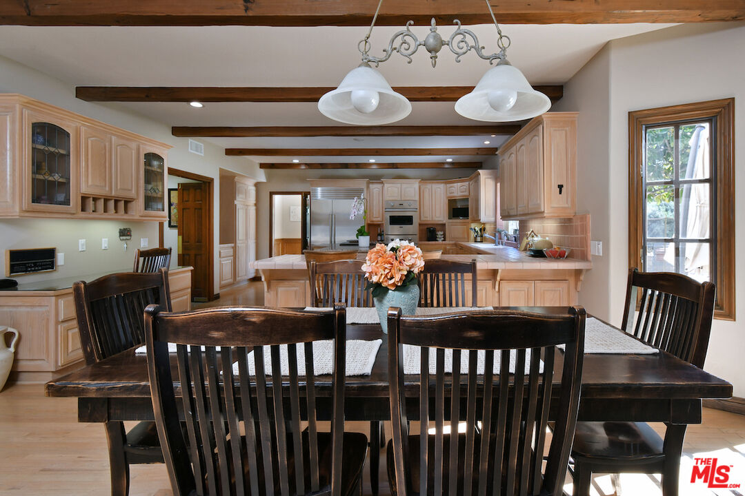 2317 Sierra Creek Road Agoura Hills, CA 91301 - Photo 20 of 73 a view of a dining room with furniture window and wooden floor