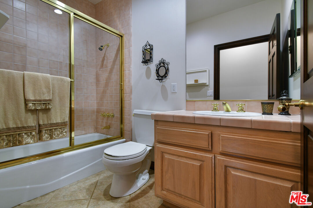 2317 Sierra Creek Road Agoura Hills, CA 91301 - Photo 25 of 73 a bathroom with a sink toilet and shower