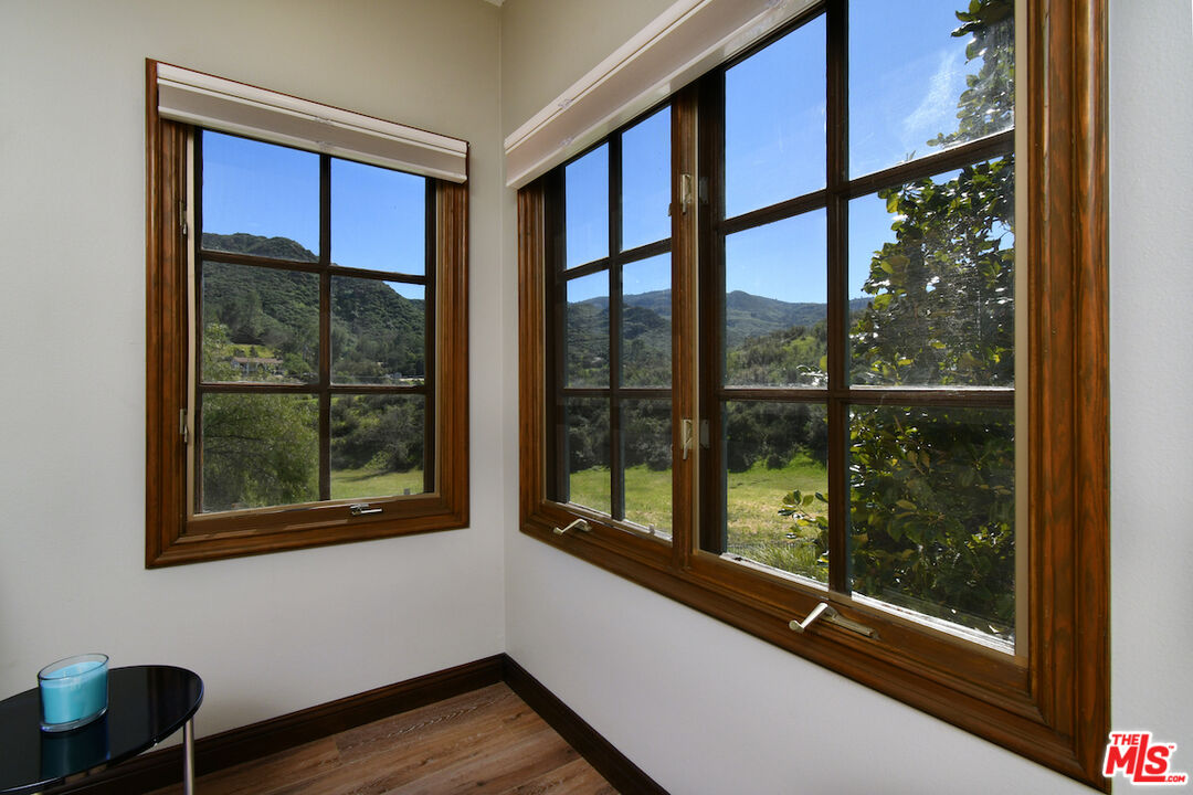 2317 Sierra Creek Road Agoura Hills, CA 91301 - Photo 29 of 73 a view of a room with wooden floor and windows