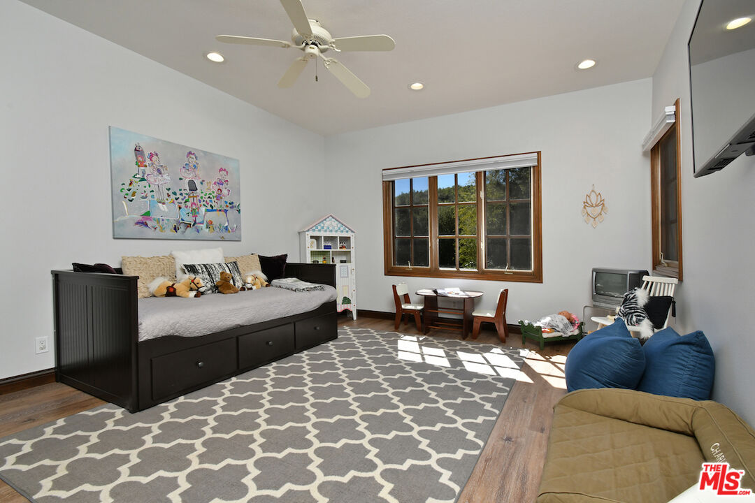 2317 Sierra Creek Road Agoura Hills, CA 91301 - Photo 35 of 73 a living room with furniture and a large window