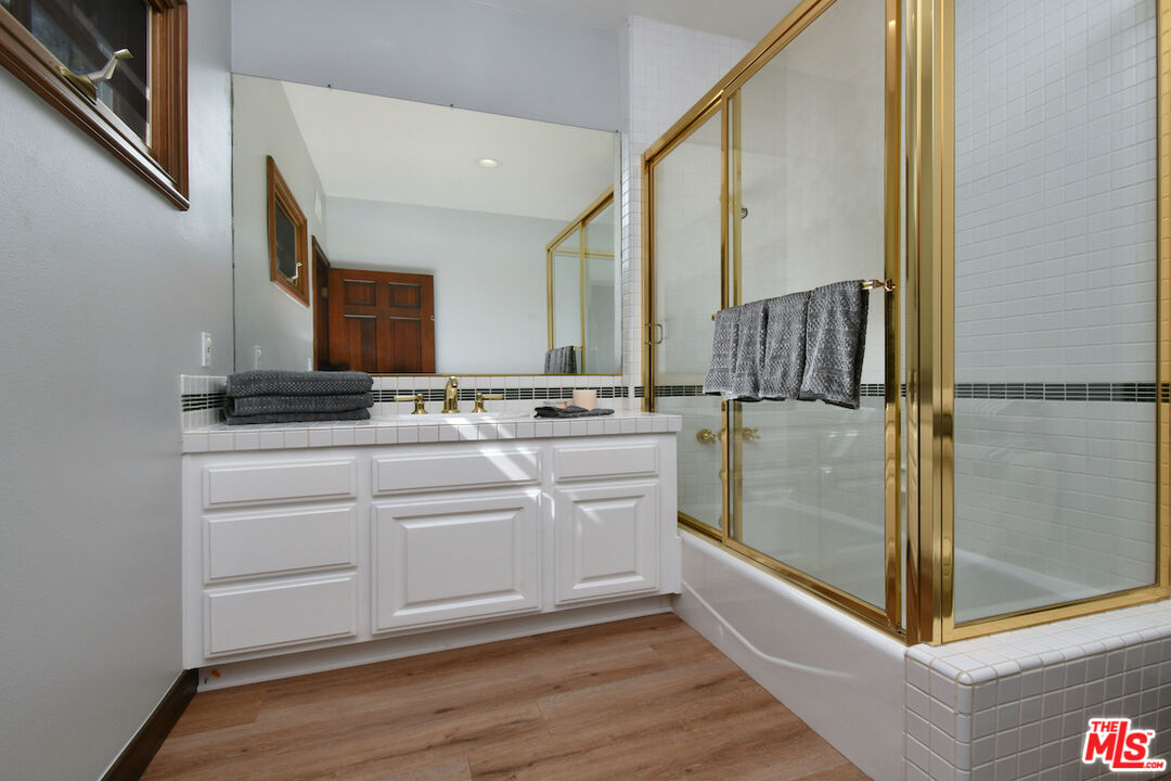 2317 Sierra Creek Road Agoura Hills, CA 91301 - Photo 37 of 73 a bathroom with a sink and a mirror