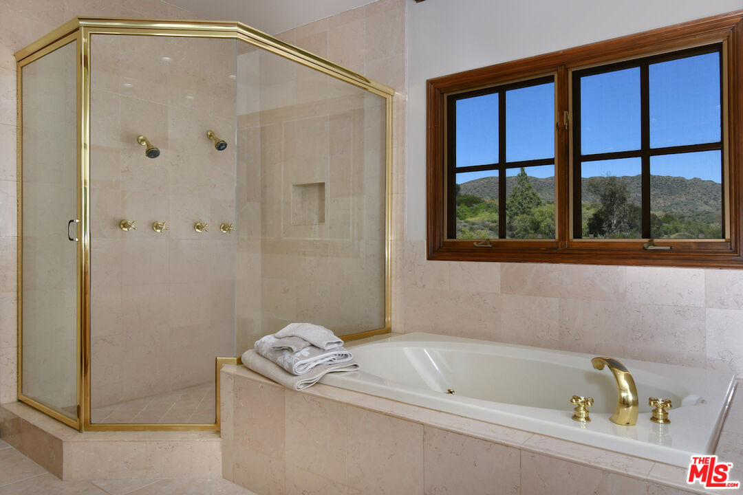 2317 Sierra Creek Road Agoura Hills, CA 91301 - Photo 46 of 73 a bathroom with a tub and a shower