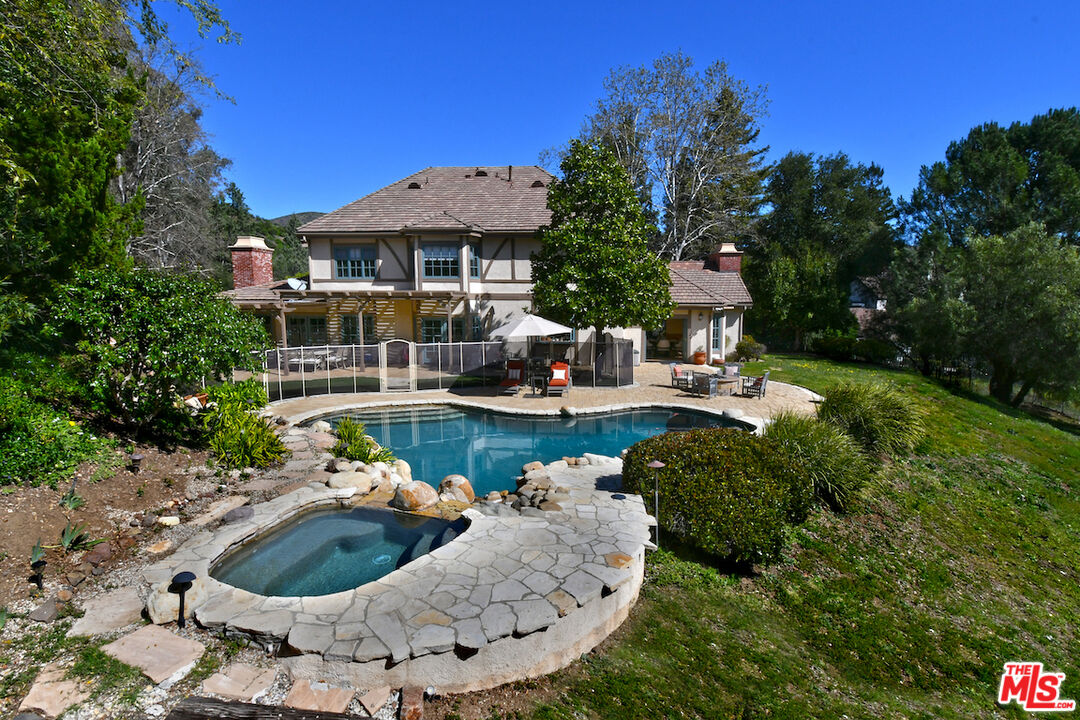 2317 Sierra Creek Road Agoura Hills, CA 91301 - Photo 6 of 73 a view of a house with swimming pool and sitting area