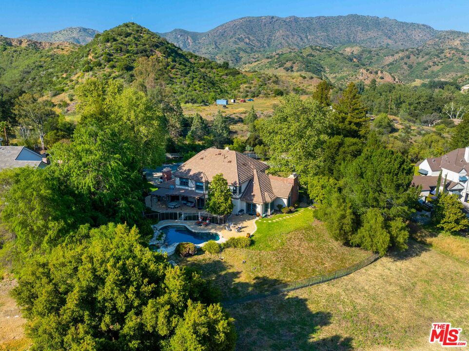 2317 Sierra Creek Road Agoura Hills, CA 91301 - Photo 71 of 73 a view of a house with a mountain yard