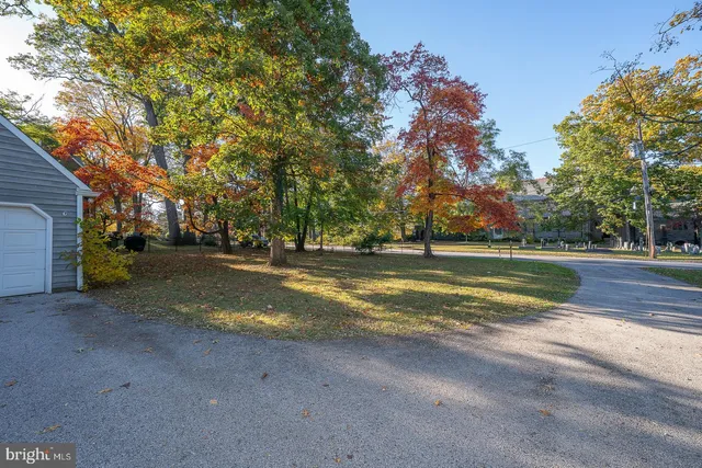 a view of the house with a yard