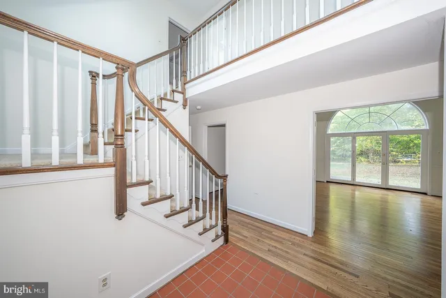 a view of an entryway with wooden floor