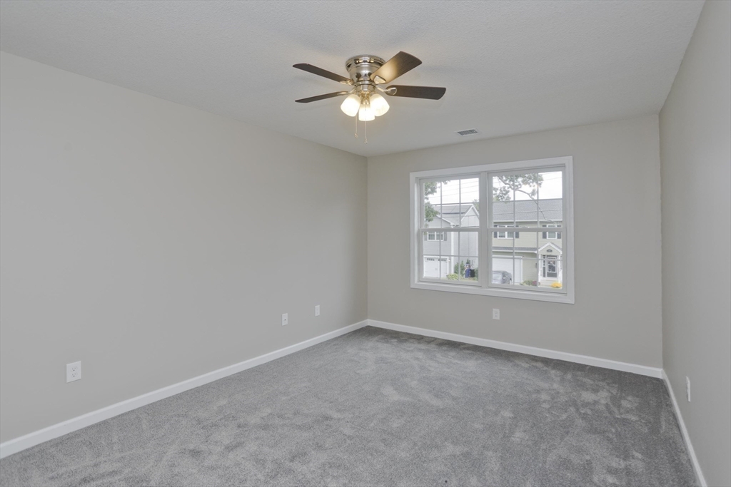 34 Chilson Street Springfield, MA 01118 - Photo 12 of 23 a view of an empty room with a window