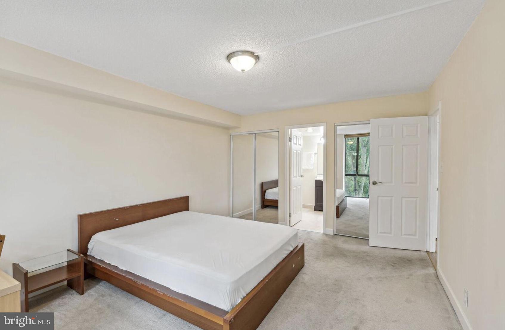 1401 North Rhodes Street, Unit 406 Arlington, VA 22209 - Photo 7 of 14 Spacious bedroom with serene ambiance.