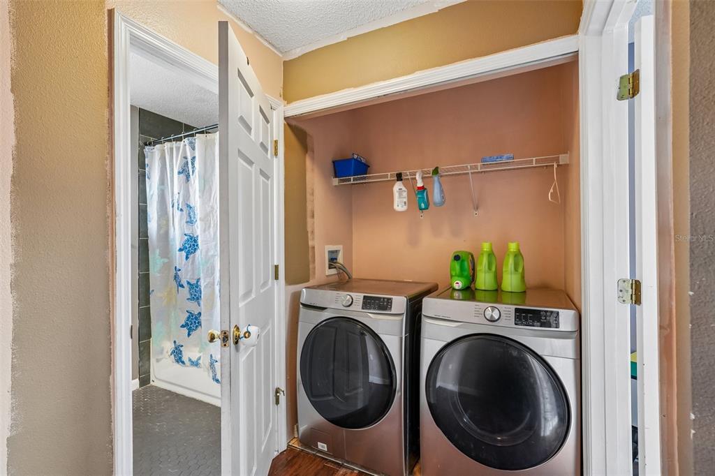 10303 Fordham Street Spring Hill, FL 34608 - Photo 18 of 25 a view of hallway with washer and dryer