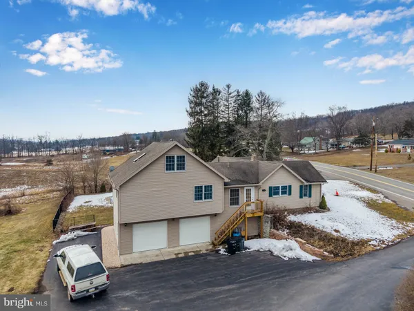 an aerial view of houses with outdoor space