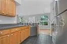 a kitchen with stainless steel appliances a refrigerator and a stove
