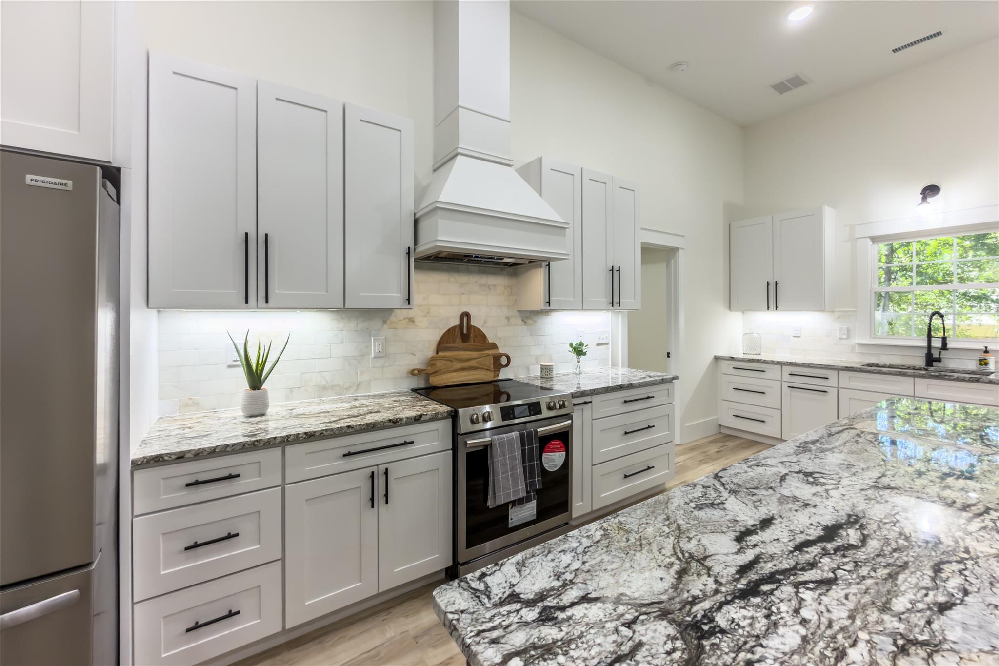 409 19th Ave Circle Northwest, Unit 12 Hickory, NC 28601 - Photo 13 of 46 a kitchen with stainless steel appliances granite countertop a stove a sink and a refrigerator