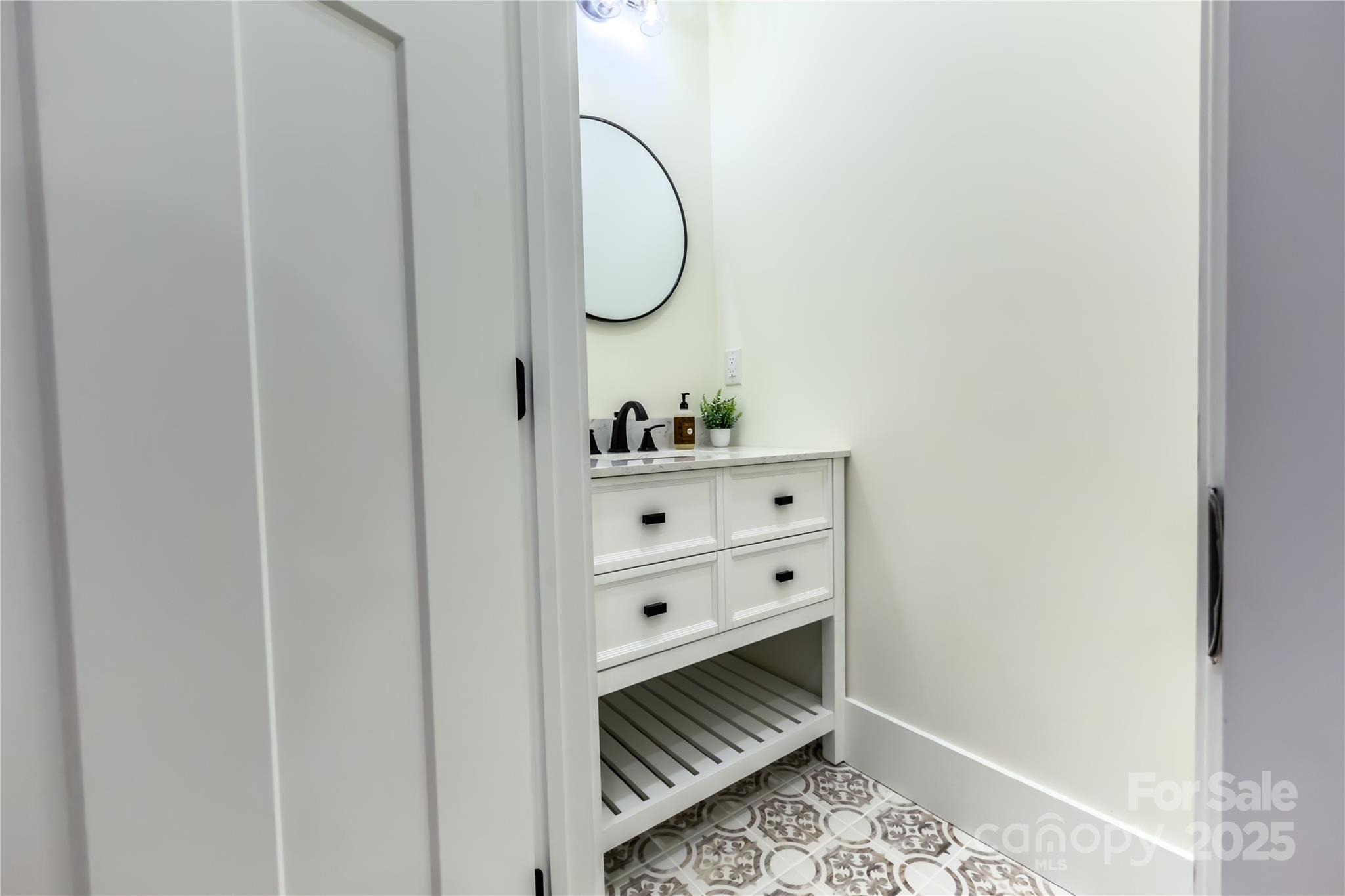 409 19th Ave Circle Northwest, Unit 12 Hickory, NC 28601 - Photo 19 of 46 a bathroom with a mirror and a sink