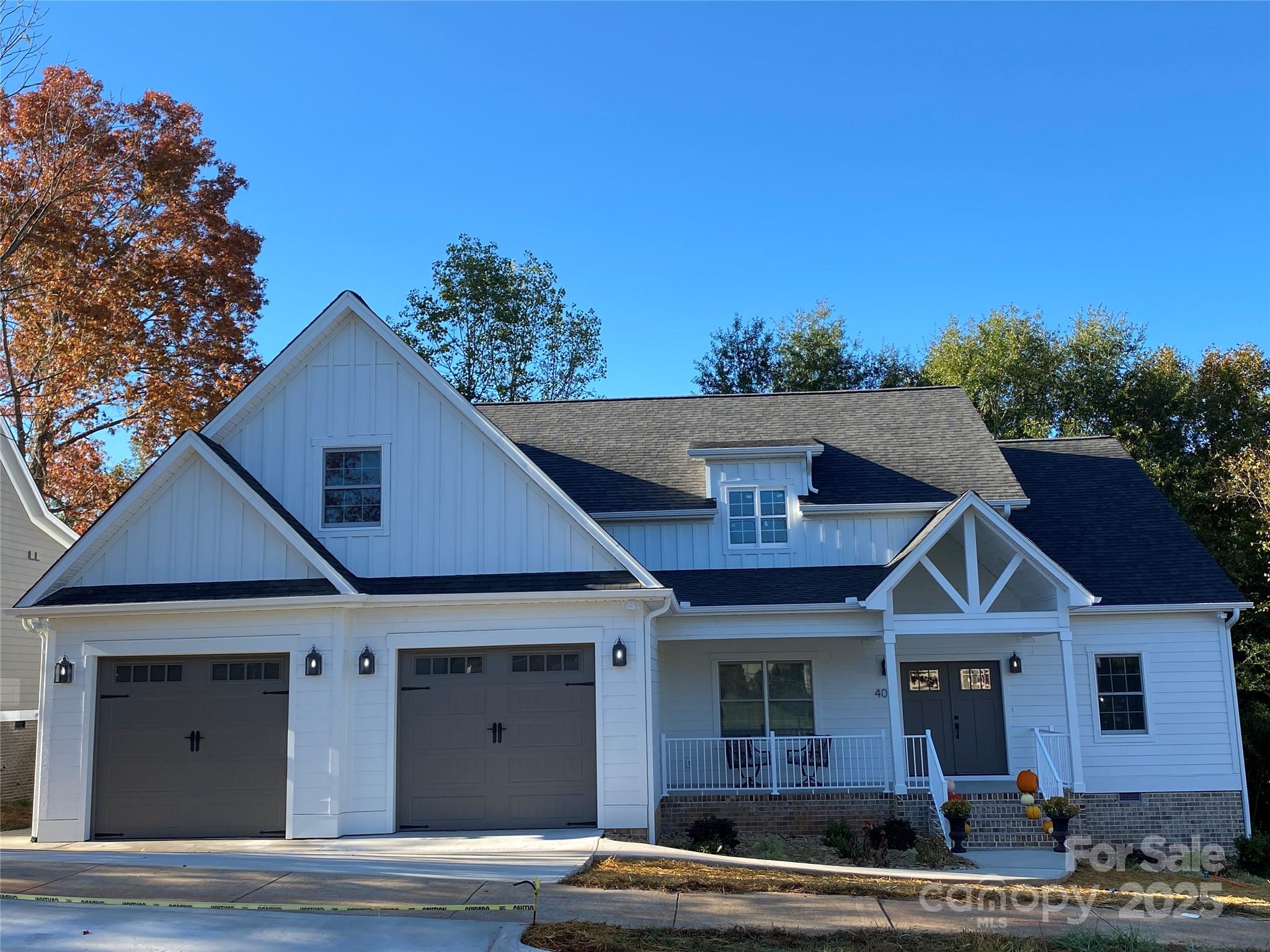 409 19th Ave Circle Northwest, Unit 12 Hickory, NC 28601 - Photo 2 of 46 a front view of a house with trees