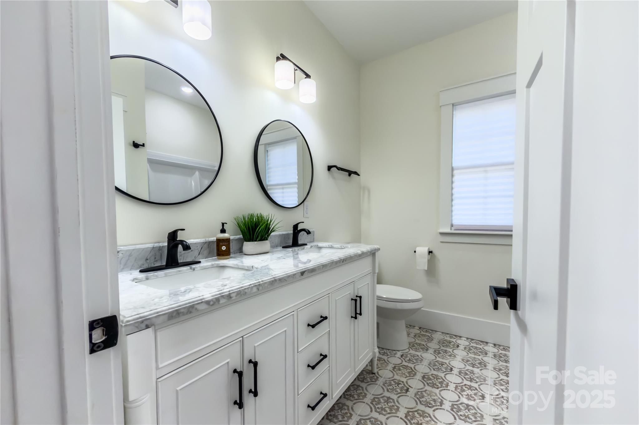 409 19th Ave Circle Northwest, Unit 12 Hickory, NC 28601 - Photo 30 of 46 a bathroom with a granite countertop sink and a mirror