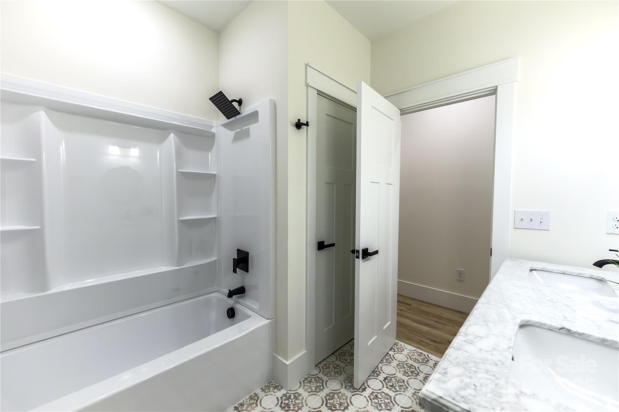 409 19th Ave Circle Northwest, Unit 12 Hickory, NC 28601 - Photo 31 of 46 a bathroom with a bathtub and a shower