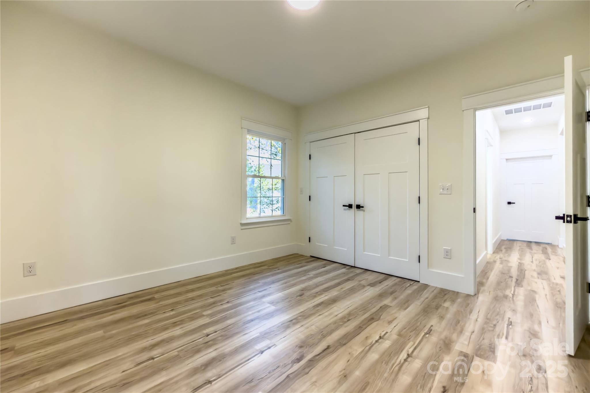 409 19th Ave Circle Northwest, Unit 12 Hickory, NC 28601 - Photo 32 of 46 a view of livingroom with hardwood floor and window