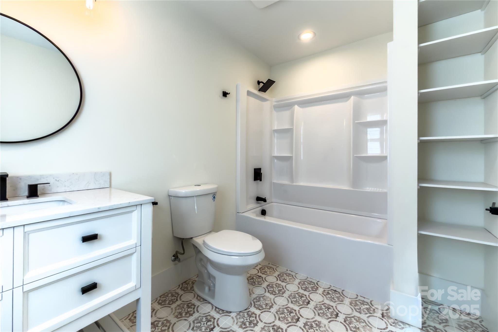 409 19th Ave Circle Northwest, Unit 12 Hickory, NC 28601 - Photo 40 of 46 a bathroom with a sink a toilet and a mirror