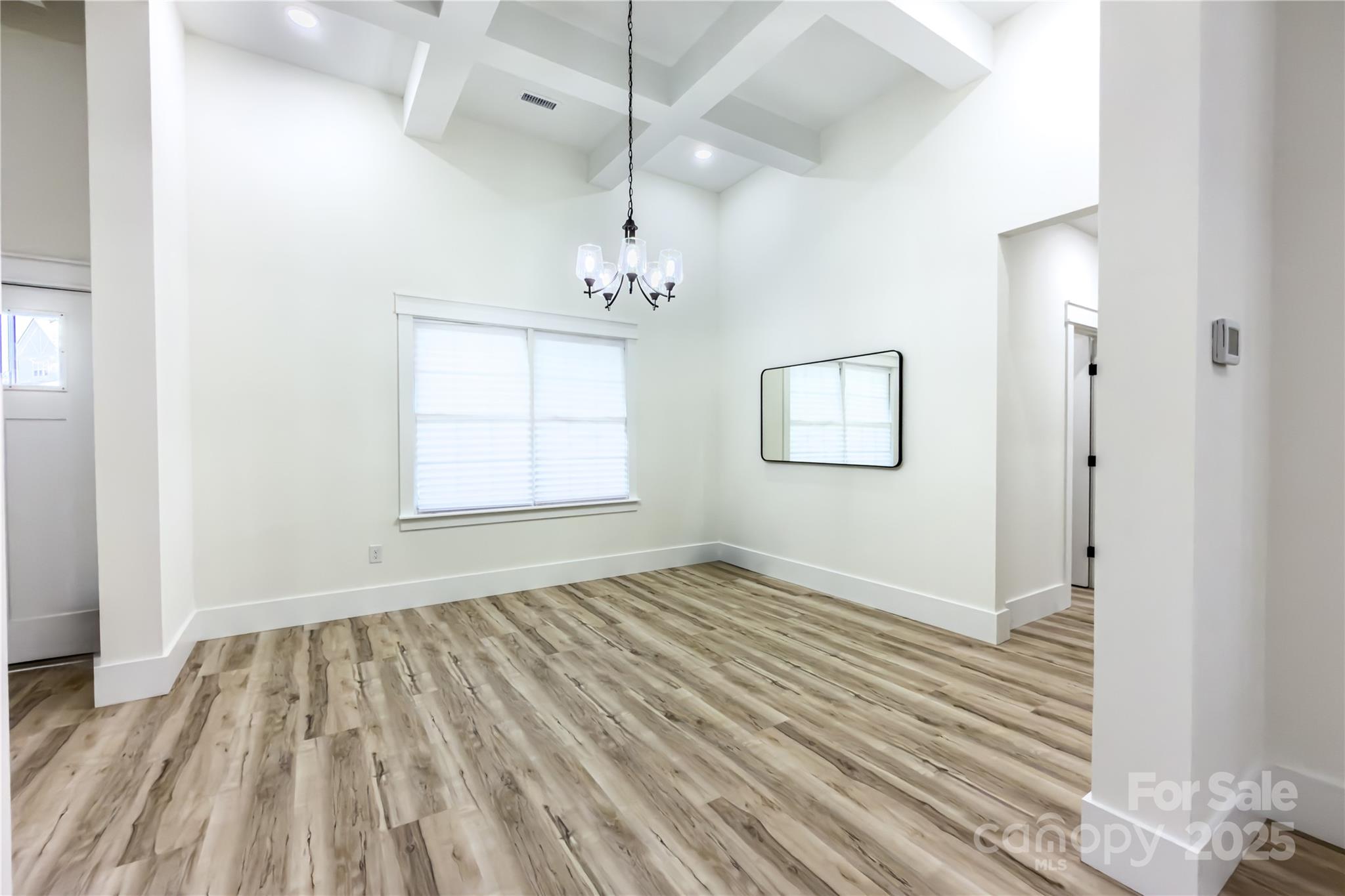 409 19th Ave Circle Northwest, Unit 12 Hickory, NC 28601 - Photo 4 of 46 a view of an empty room with wooden floor and a window