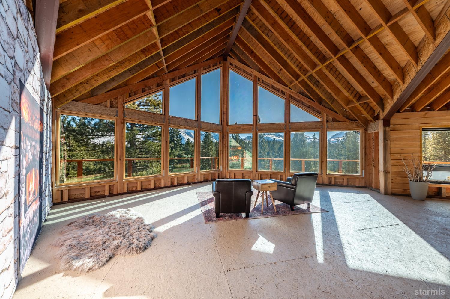 205 Raymond View Road Markleeville, CA 96120 - Photo 5 of 14 a living room with furniture and large windows