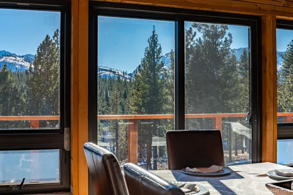 a view of a chairs and a table in the patio