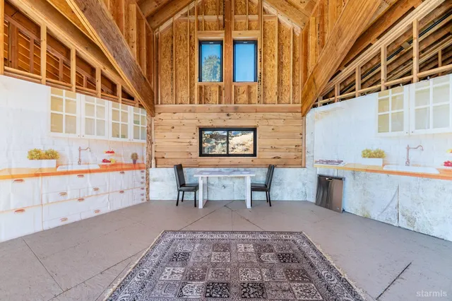 a view of a house with backyard porch and sitting area