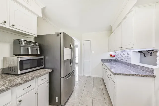 a bedroom with a bed and ceiling fan
