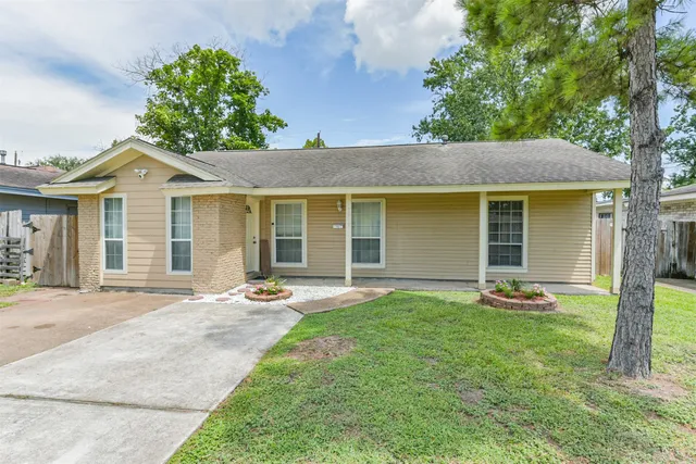 front view of a house with a yard