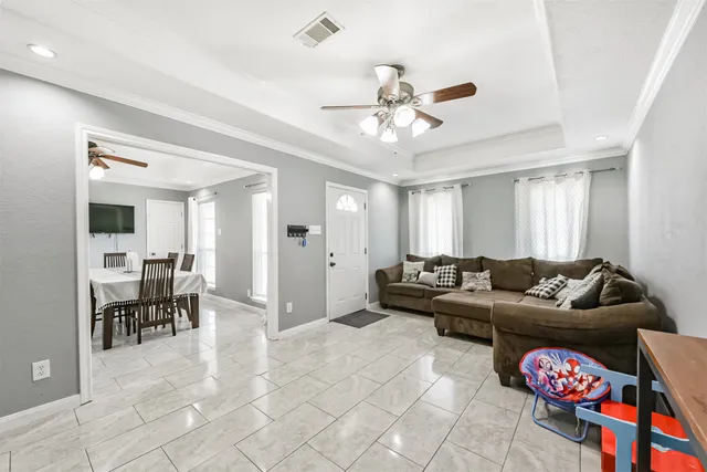a view of a dining room with furniture and a window