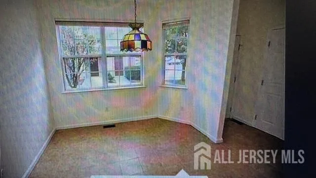 an entryway with wooden floor