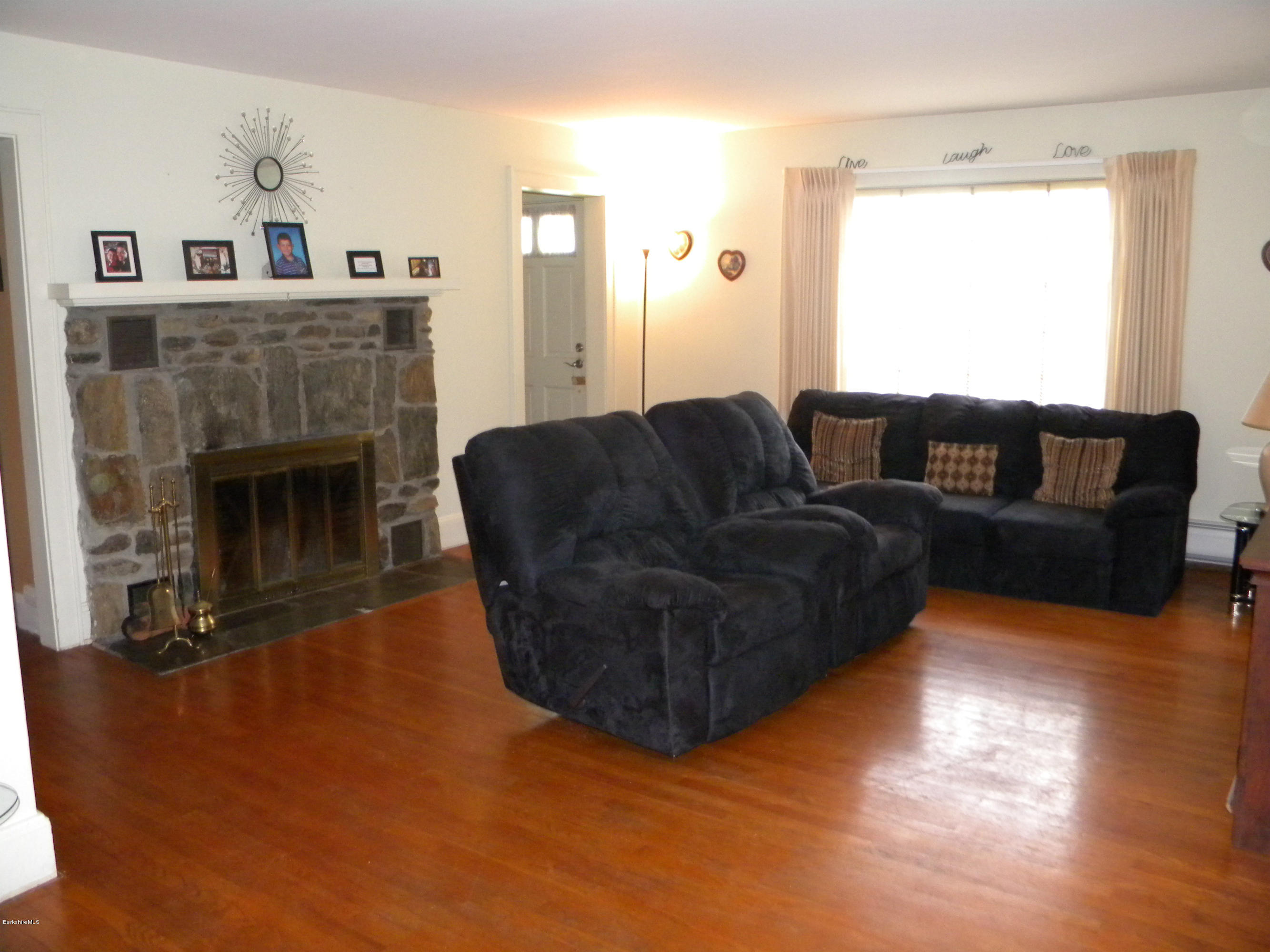 3 Whitcomb Hill Road Florida, MA 01343 - Photo 3 of 14 a living room with furniture and a fireplace