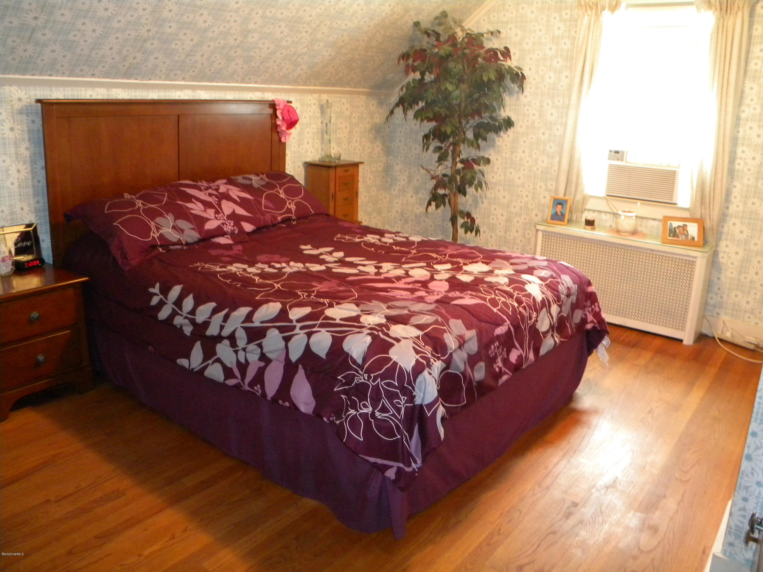 3 Whitcomb Hill Road Florida, MA 01343 - Photo 7 of 14 a bed sitting in a bedroom next to a window