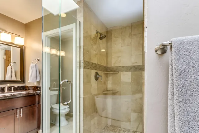 a bathroom with a shower and a sink