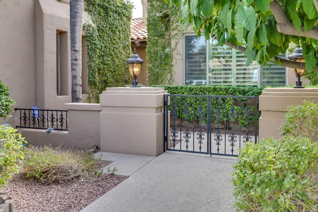 a view of a house with a small yard and plants