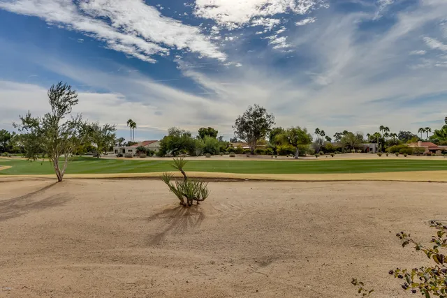 a view of a lake with a yard