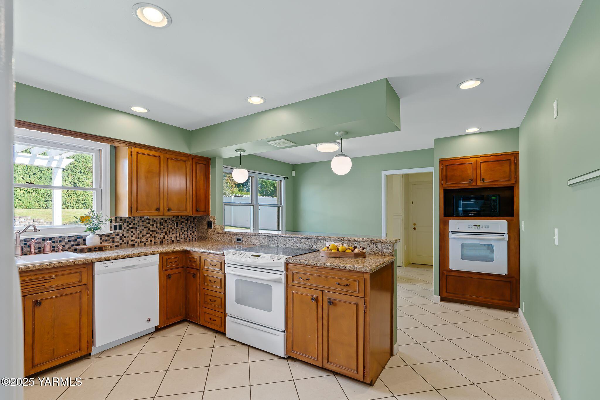 3609 Richey Road Yakima, WA 98902 - Photo 12 of 33 a kitchen with a sink and cabinets