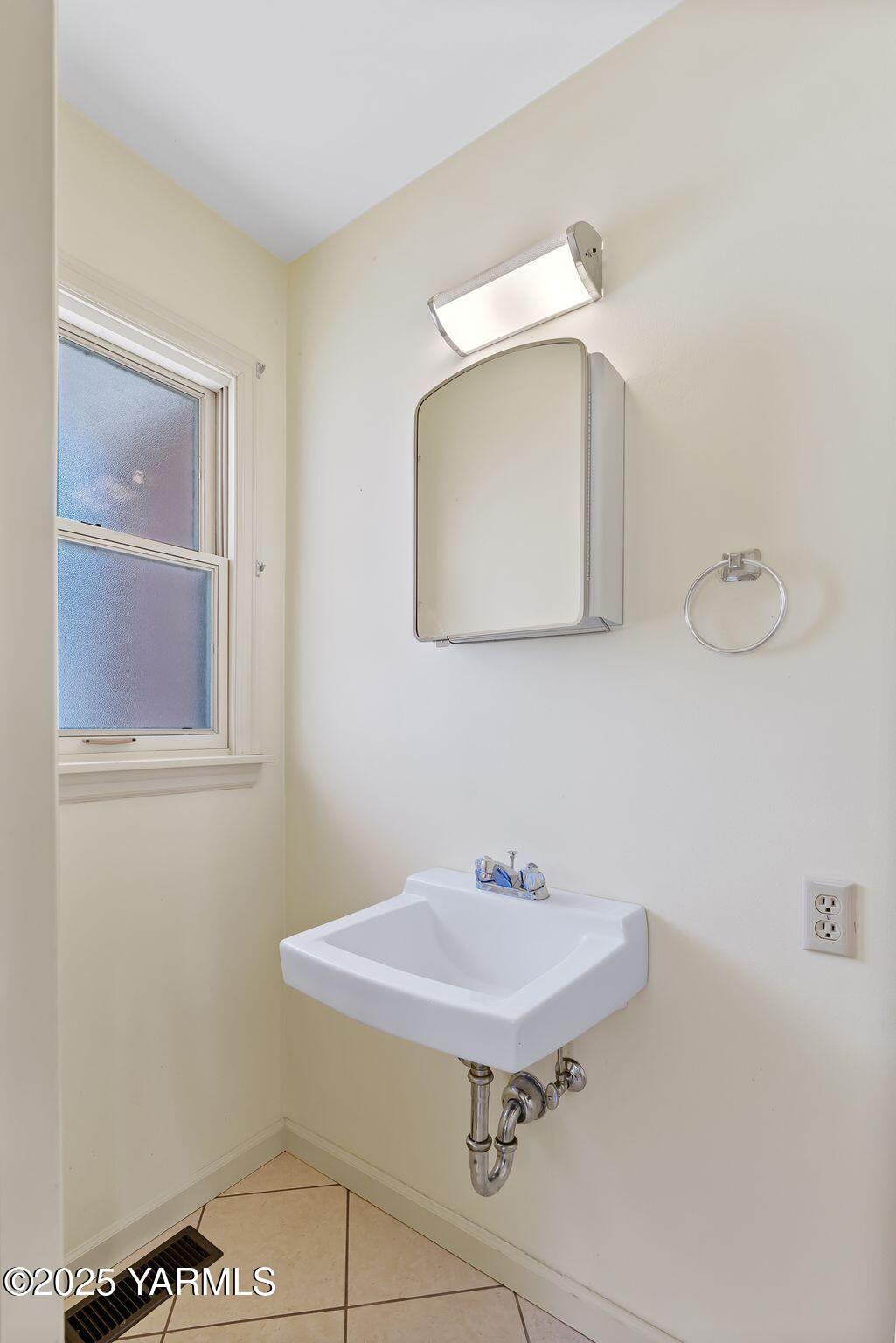 3609 Richey Road Yakima, WA 98902 - Photo 17 of 33 a bathroom with a sink mirror and vanity