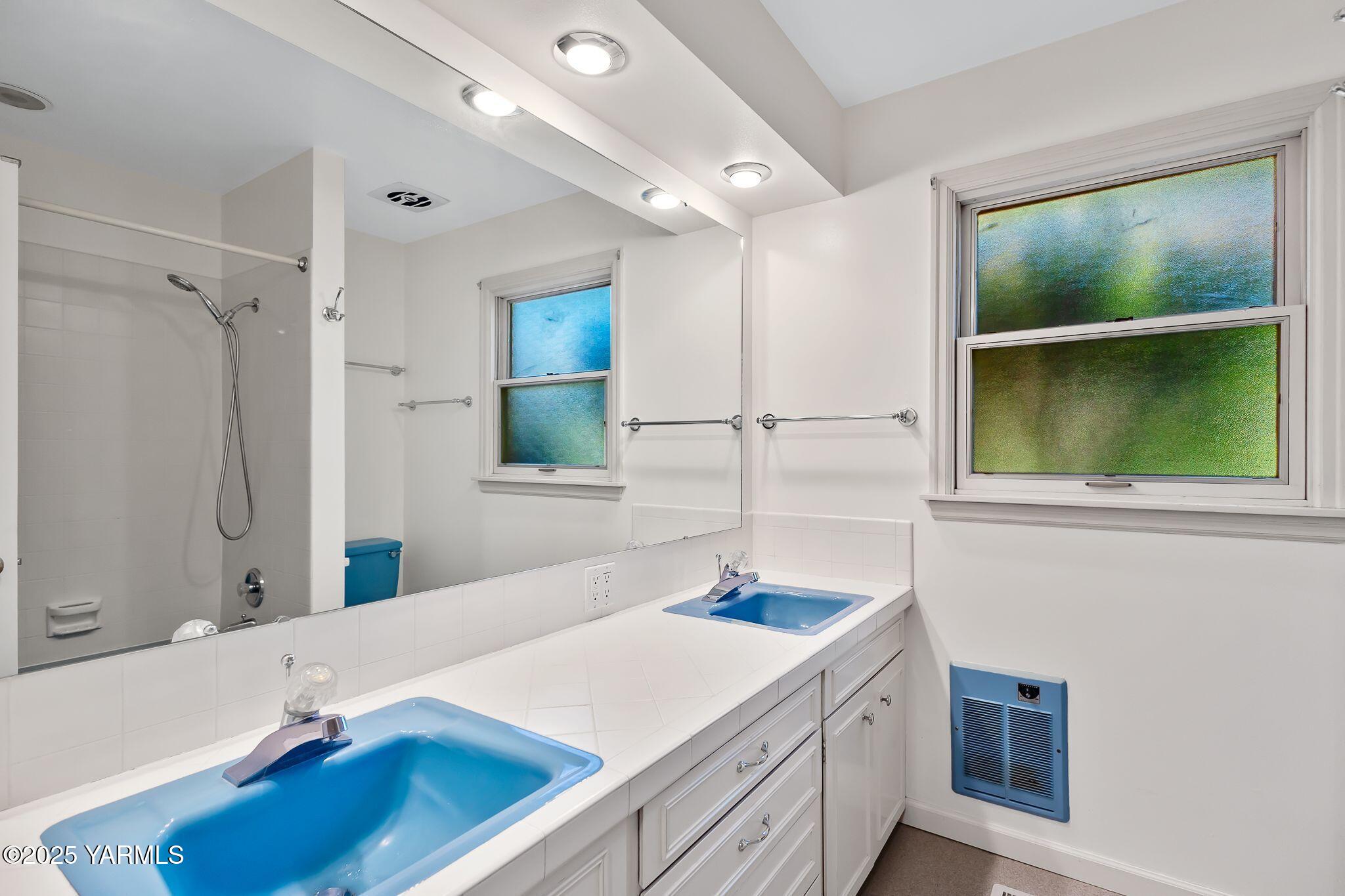 3609 Richey Road Yakima, WA 98902 - Photo 19 of 33 a bathroom with a sink and a mirror