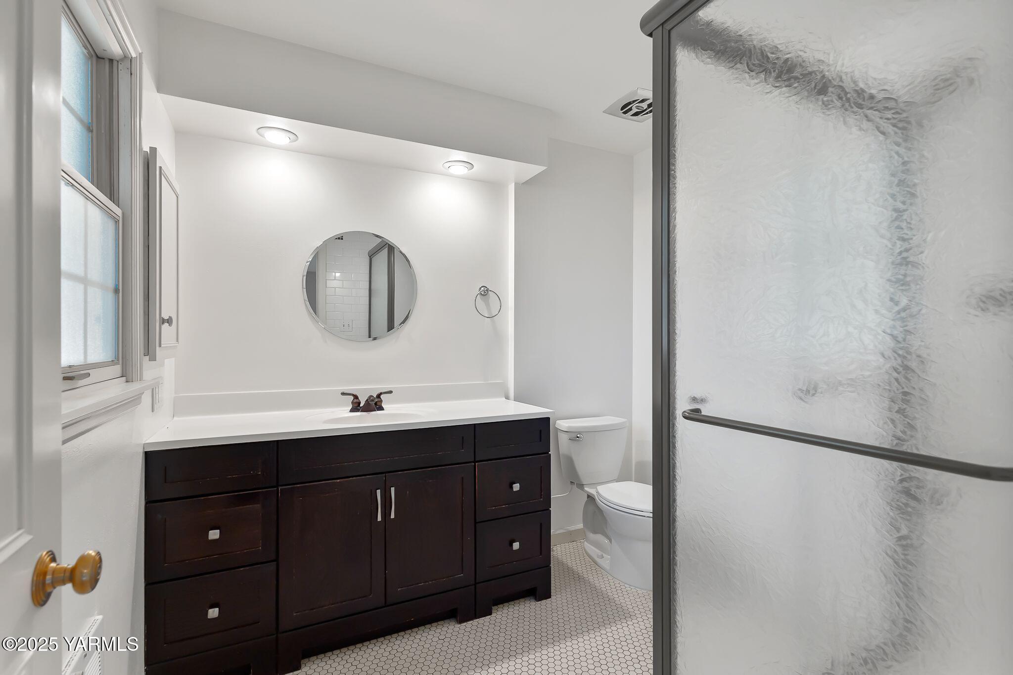 3609 Richey Road Yakima, WA 98902 - Photo 23 of 33 a bathroom with a double vanity sink and a mirror