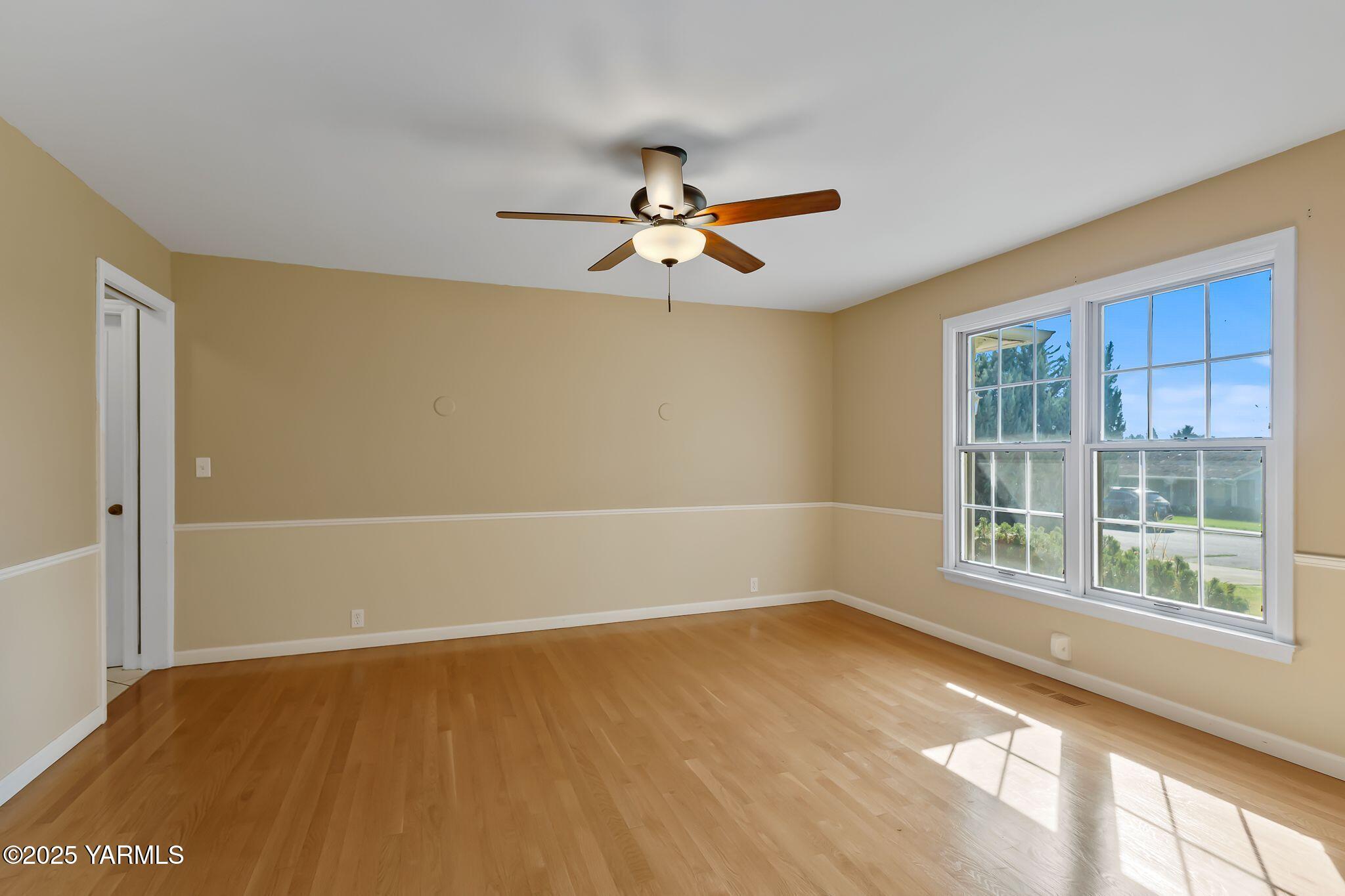 3609 Richey Road Yakima, WA 98902 - Photo 8 of 33 wooden floor in an empty room with a window