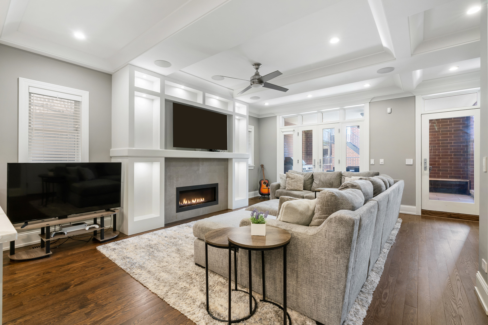 729 West Barry Avenue, Unit 1 Chicago, IL 60657 - Photo 11 of 34 a living room with furniture a flat screen tv and a fireplace