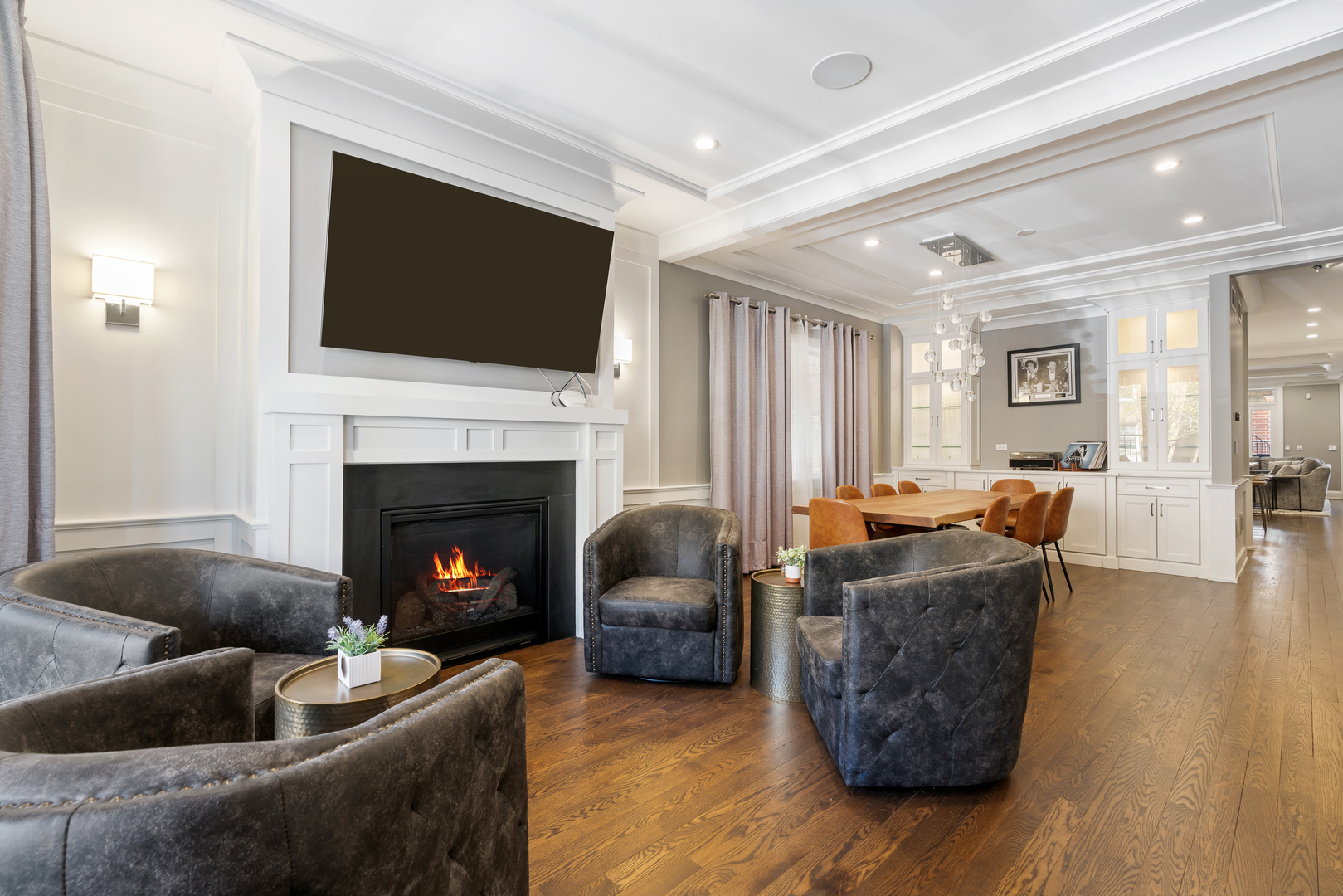 729 West Barry Avenue, Unit 1 Chicago, IL 60657 - Photo 2 of 34 a living room with furniture a flat screen tv and a fireplace