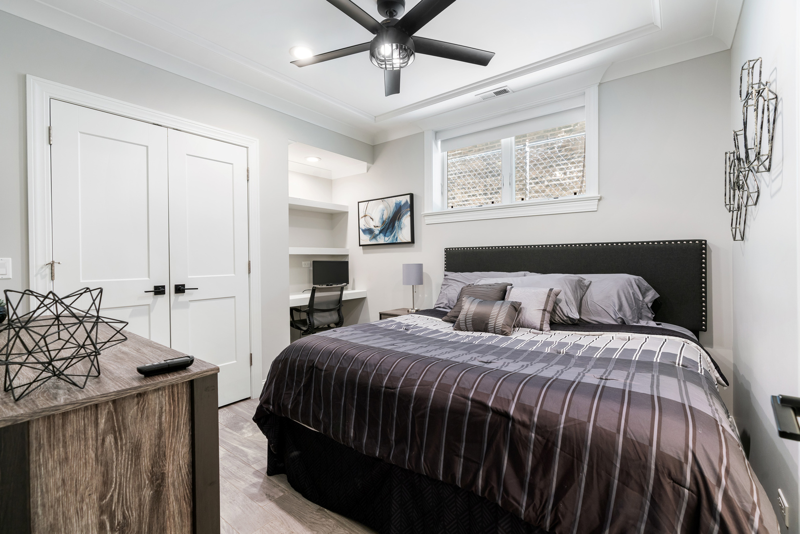 729 West Barry Avenue, Unit 1 Chicago, IL 60657 - Photo 21 of 34 a bedroom with a bed a window and a chandelier