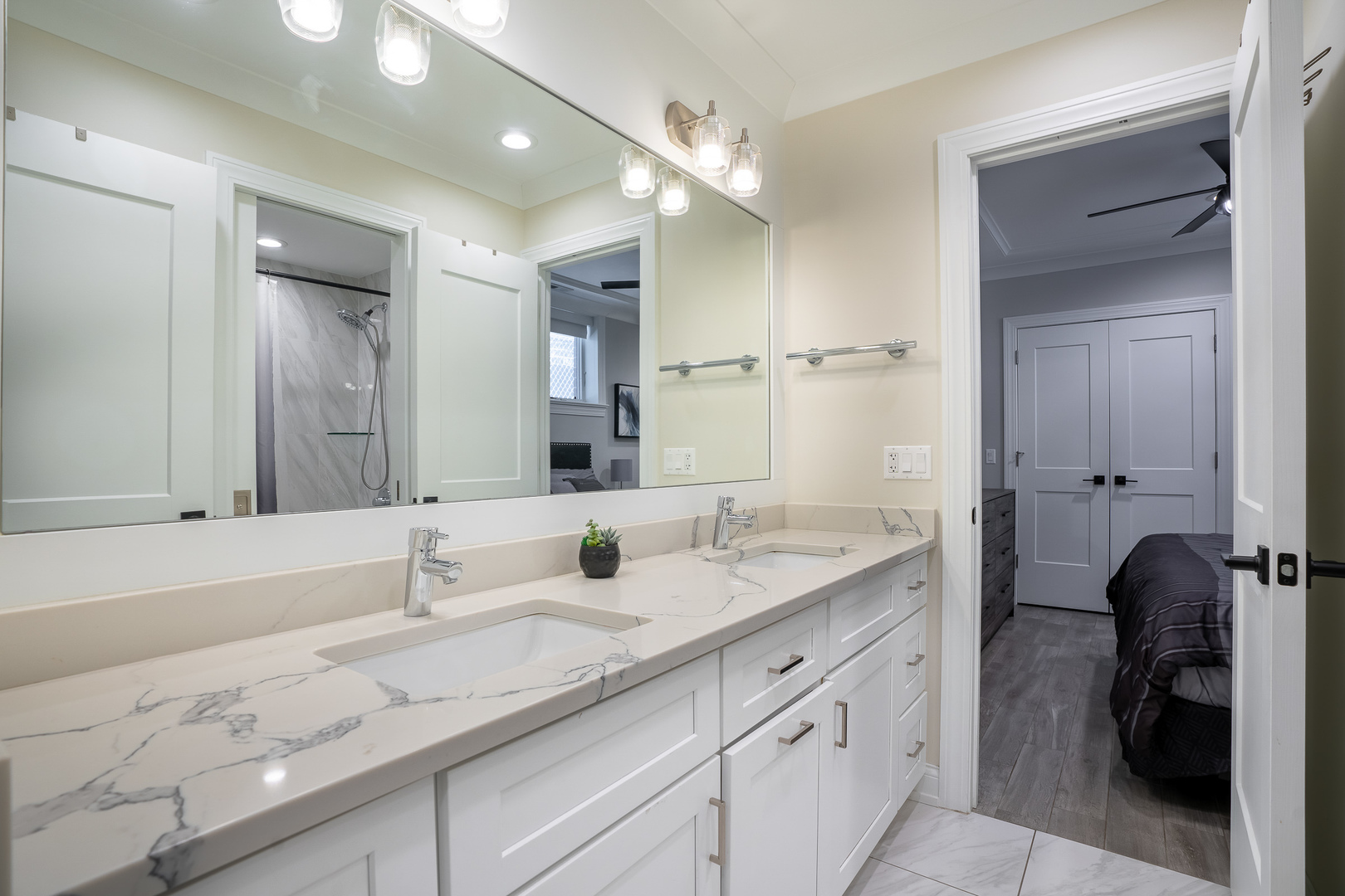729 West Barry Avenue, Unit 1 Chicago, IL 60657 - Photo 22 of 34 a bathroom with a sink double vanity and a mirror