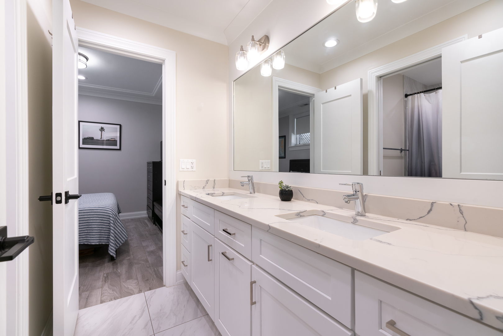 729 West Barry Avenue, Unit 1 Chicago, IL 60657 - Photo 24 of 34 a en suite bathroom with a double vanity sink double and mirror