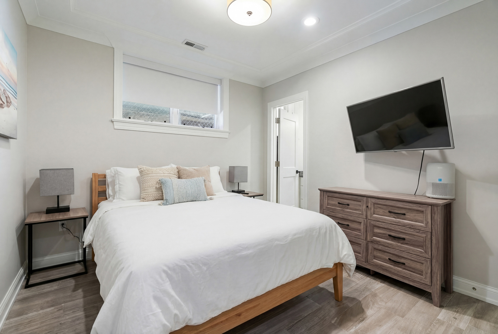 729 West Barry Avenue, Unit 1 Chicago, IL 60657 - Photo 26 of 34 a bedroom with a bed and a flat screen tv